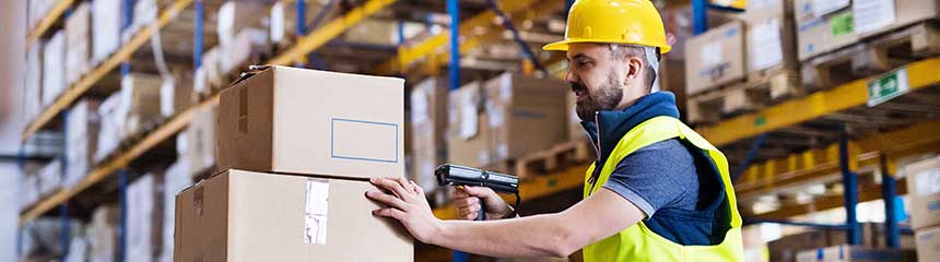 Male warehouse worker with barcode scanner