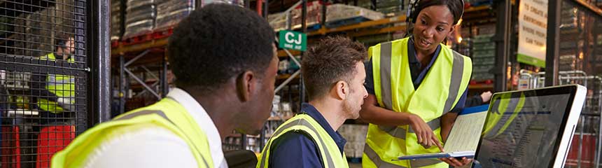 Team discussing warehouse logistics in an on-site office